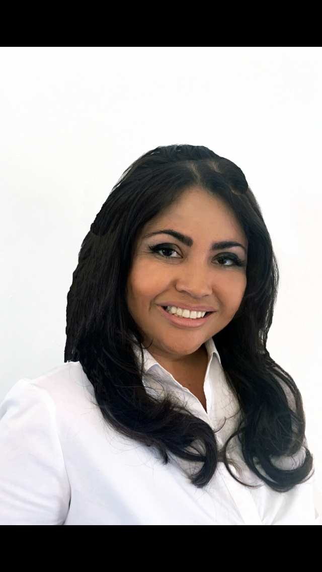 Dr. Fanny Bui smiling in a white blouse